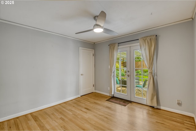 unfurnished room featuring french doors, baseboards, wood finished floors, and crown molding