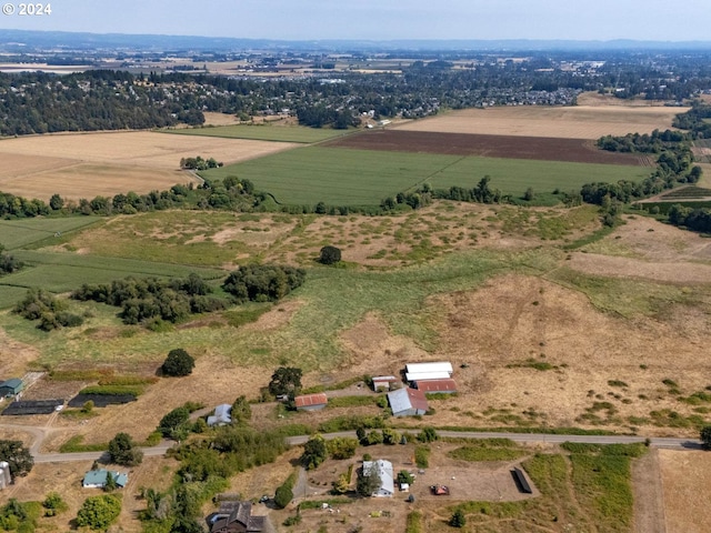 birds eye view of property with a rural view