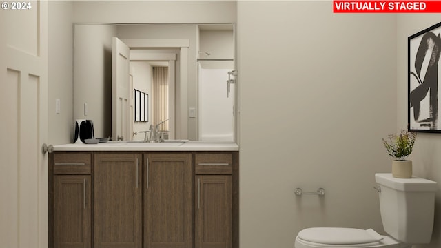 bathroom featuring walk in shower, vanity, and toilet