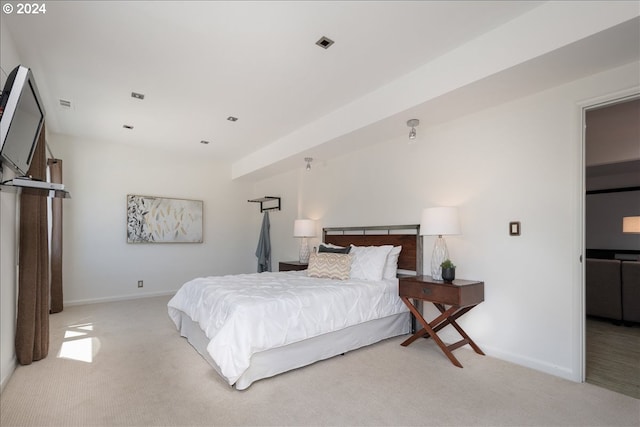 bedroom featuring light carpet