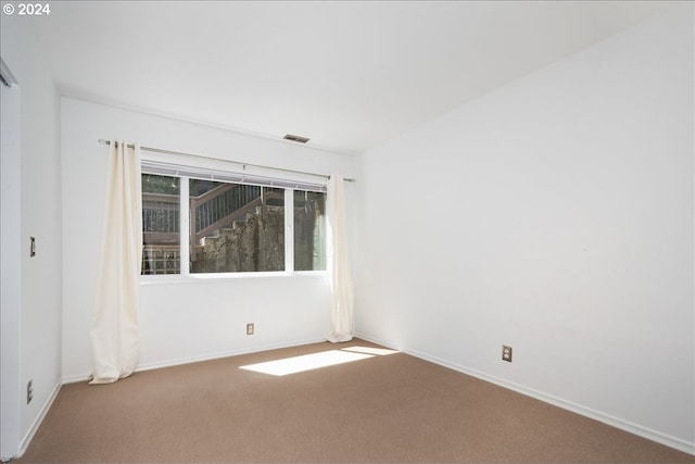 empty room featuring carpet flooring