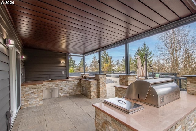 view of patio with area for grilling and grilling area