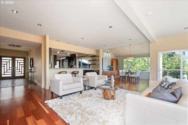 living room featuring french doors, vaulted ceiling with beams, and dark wood-type flooring