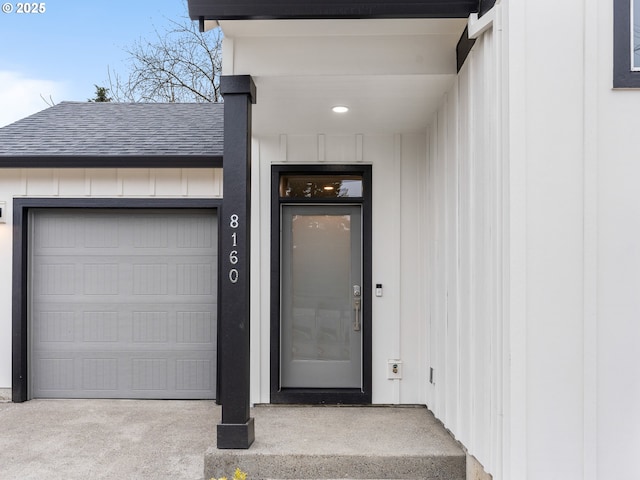 property entrance with a garage and elevator