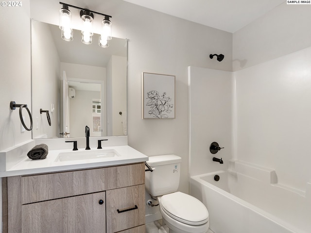 full bathroom with shower / washtub combination, large vanity, and toilet