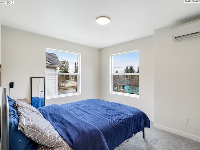 carpeted bedroom with an AC wall unit