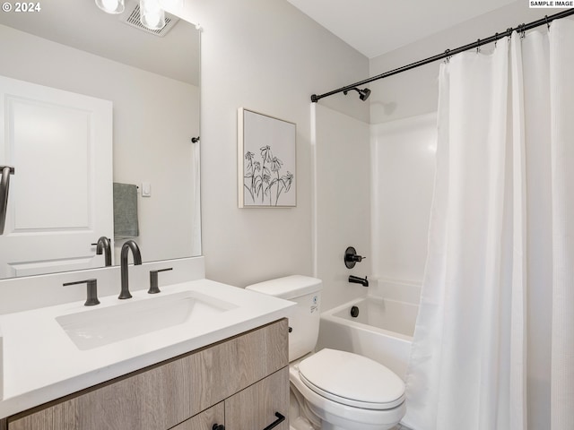 full bathroom with shower / tub combo, toilet, and vanity