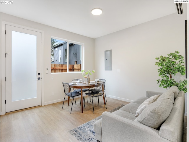 dining area featuring light wood-type flooring