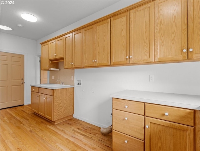 kitchen with light hardwood / wood-style floors and sink