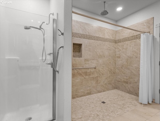 bathroom with a shower with curtain and tile patterned flooring