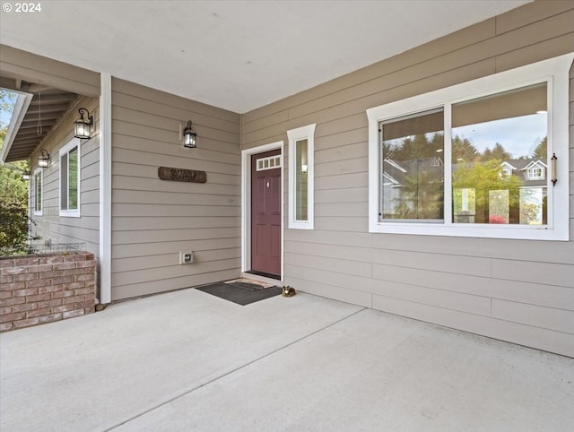 doorway to property with a patio