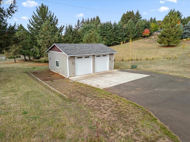 garage with a yard