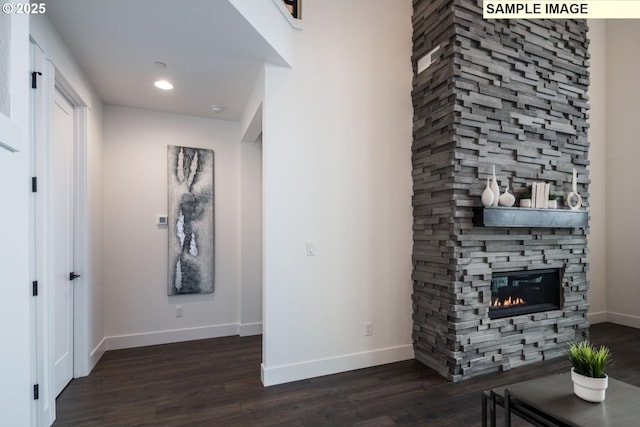 1004 S Mountain Pl, Ridgefield, WA 98642 - living room featuring baseboards, wood finished floors, a stone fireplace, and recessed lighting