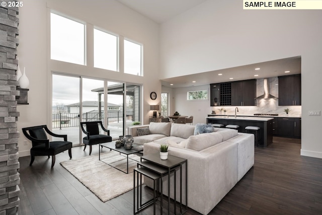 1004 S Mountain Pl, Ridgefield, WA 98642 - living room with dark wood-type flooring, a high ceiling, and baseboards
