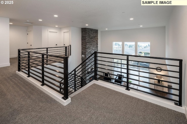 1004 S Mountain Pl, Ridgefield, WA 98642 - hall featuring an upstairs landing, carpet flooring, recessed lighting, and baseboards