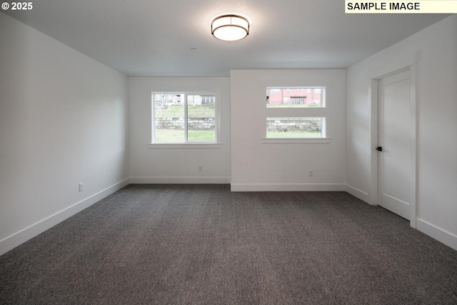 1004 S Mountain Pl, Ridgefield, WA 98642 - empty room with dark carpet and baseboards