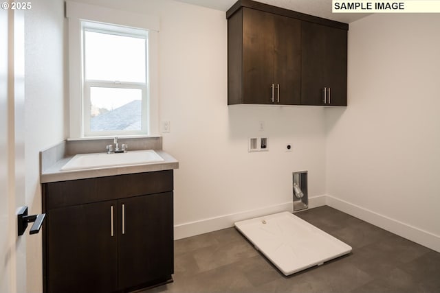 1004 S Mountain Pl, Ridgefield, WA 98642 - laundry area featuring hookup for an electric dryer, washer hookup, cabinet space, and baseboards