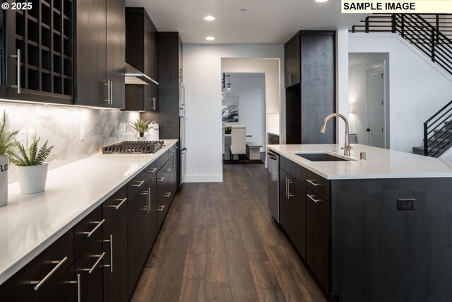 1004 S Mountain Pl, Ridgefield, WA 98642 - kitchen featuring a sink, appliances with stainless steel finishes, light countertops, dark wood-style flooring, and recessed lighting