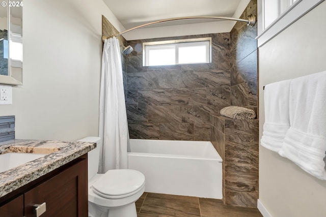 full bathroom featuring shower / bathtub combination with curtain, vanity, and toilet