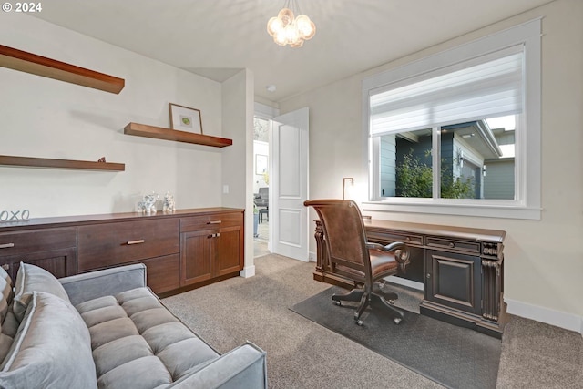 office area featuring light carpet and built in desk