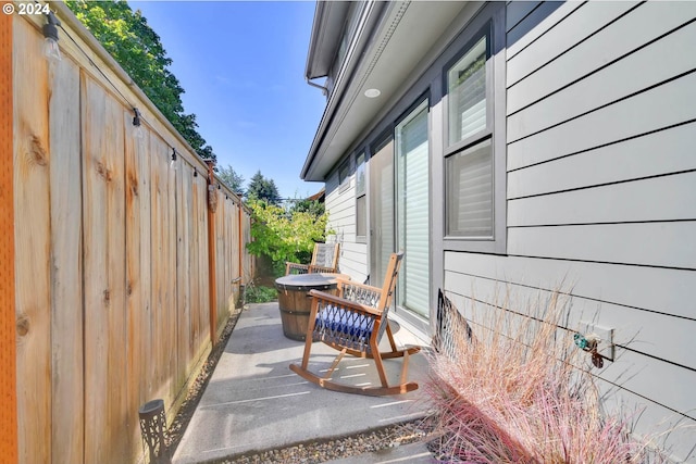 view of side of property with a patio