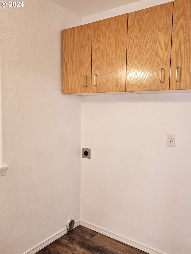 laundry area with dark hardwood / wood-style flooring, cabinets, and hookup for an electric dryer