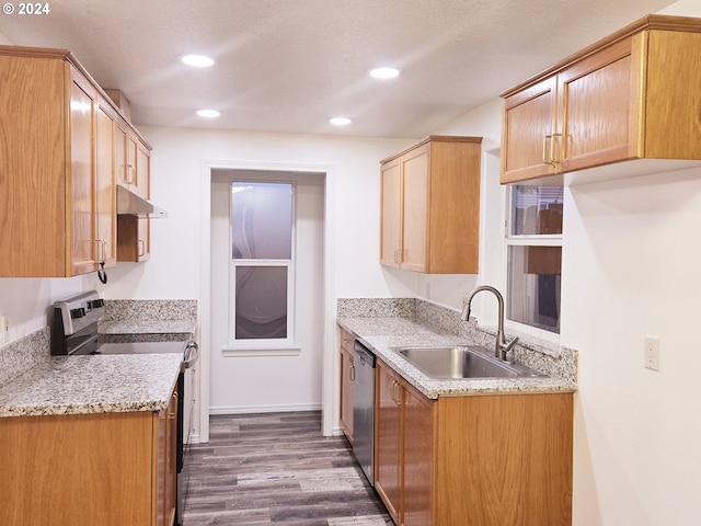 kitchen featuring a textured ceiling, dark hardwood / wood-style floors, sink, and appliances with stainless steel finishes