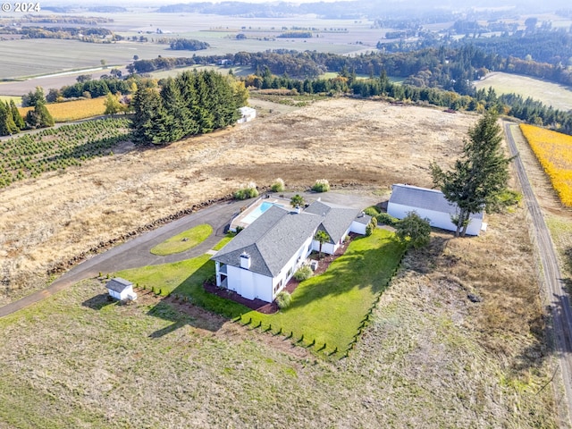 birds eye view of property featuring a rural view