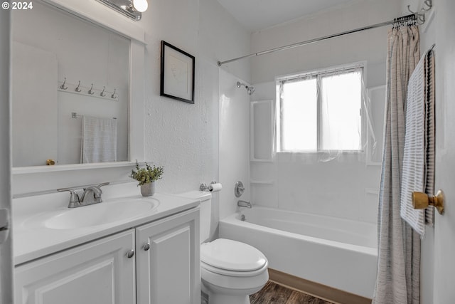 full bathroom with shower / tub combo, vanity, toilet, and wood-type flooring