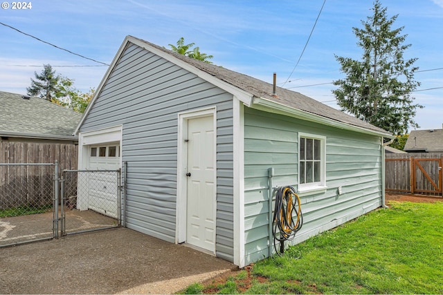 view of outbuilding featuring a yard