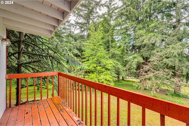 wooden terrace with a yard