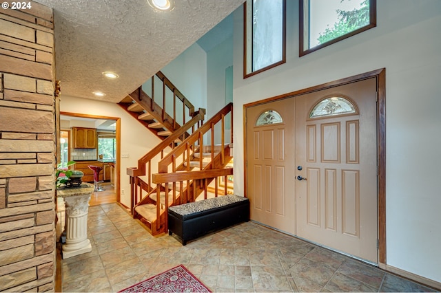 entryway featuring a textured ceiling