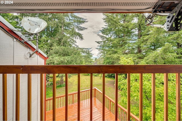 wooden balcony featuring a deck