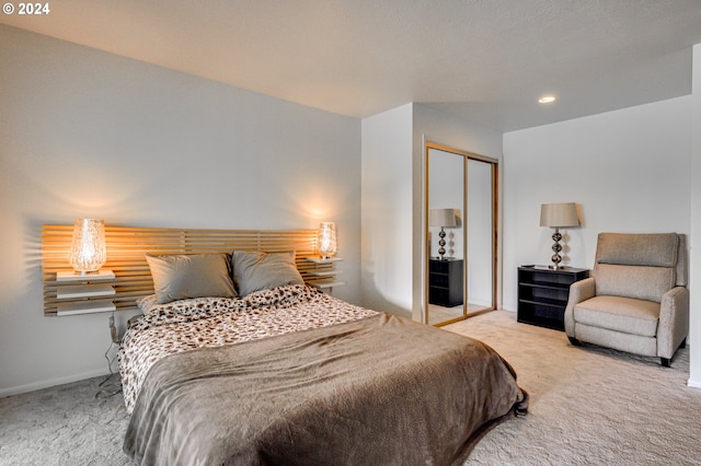 bedroom with a closet and light colored carpet