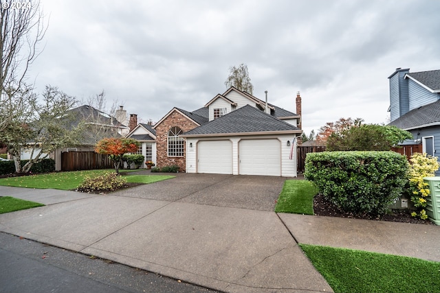 view of front facade featuring a front yard and a garage