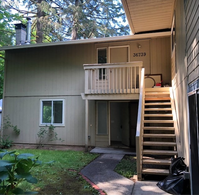 rear view of house with a balcony