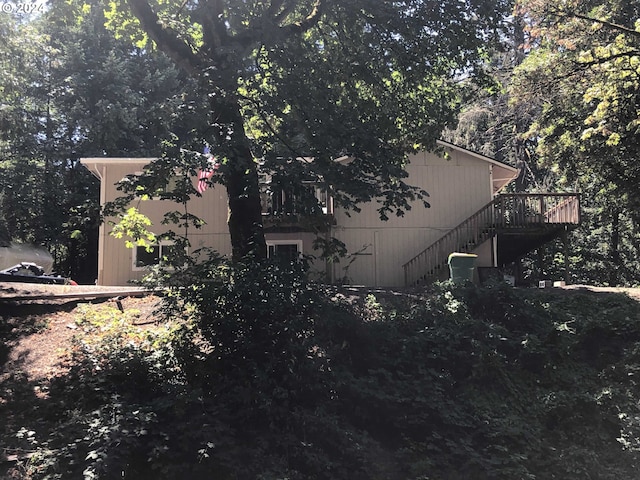 view of property exterior with a deck