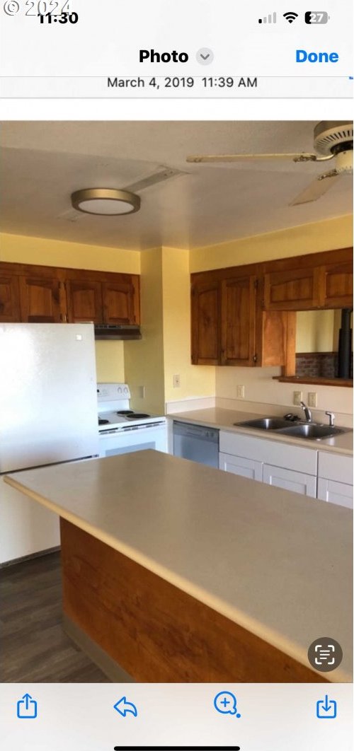 kitchen featuring sink, white appliances, and dark hardwood / wood-style flooring