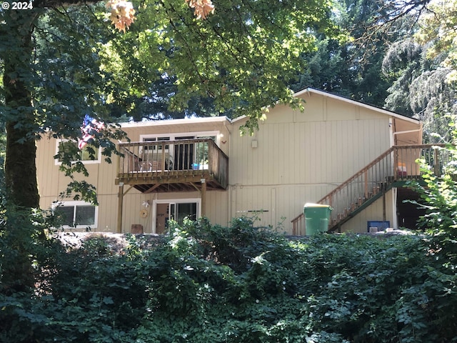 back of house with a balcony