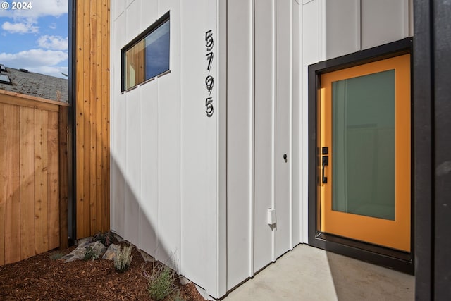 doorway to property with board and batten siding