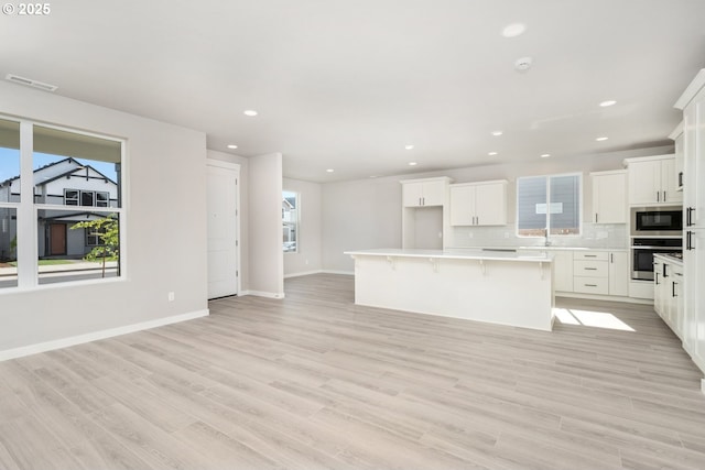 3104 S Kodiak St Unit Lt814, Cornelius, OR 97113 - kitchen with appliances with stainless steel finishes, a center island, healthy amount of natural light, backsplash, and recessed lighting