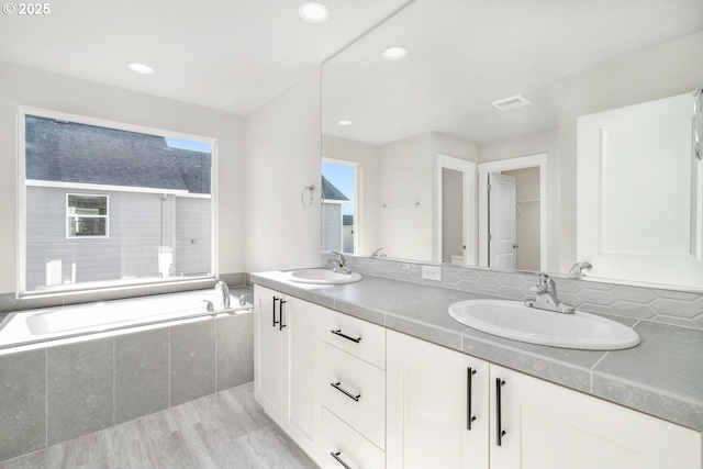 3104 S Kodiak St Unit Lt814, Cornelius, OR 97113 - bathroom with double vanity, a bath, wood finished floors, and recessed lighting
