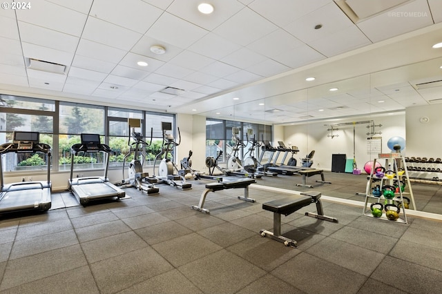 exercise room with floor to ceiling windows