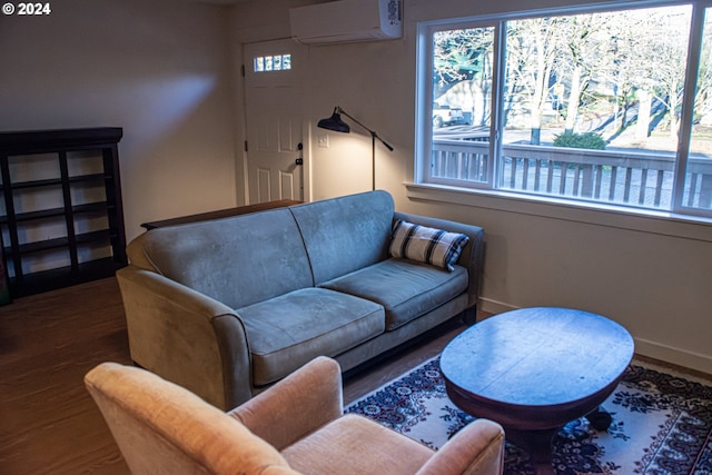 living room with a wall unit AC and dark wood-type flooring