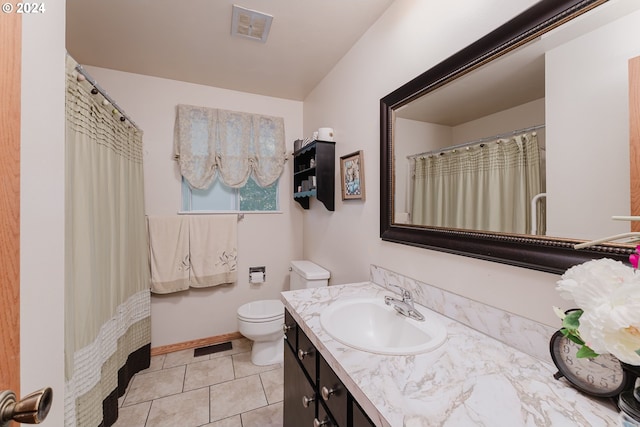 bathroom featuring vanity, toilet, and tile patterned floors