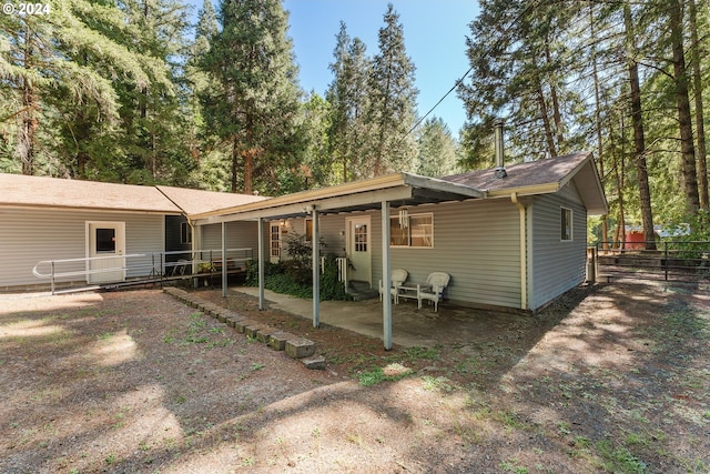 rear view of property featuring a patio