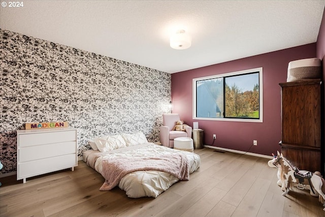 bedroom featuring light wood-type flooring