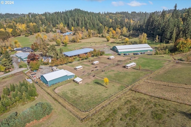 birds eye view of property with a rural view