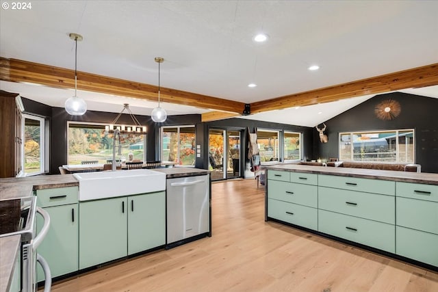 kitchen with stainless steel appliances, pendant lighting, plenty of natural light, and lofted ceiling with beams