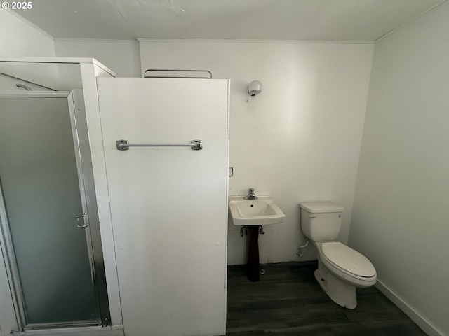 432 2nd Ave, Powers, OR 97466 - full bath with a shower stall, wood finished floors, toilet, and crown molding